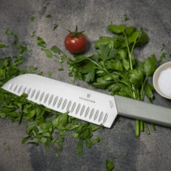 Swiss Modern Colors 7.5" Granton Edge Santoku Knife In Olive Green By Victorinox 14 Swiss Modern Colors 7.5" Granton Edge Santoku Knife In Olive Green By Victorinox -Multifunctional Tool Store VF6905617K6 Swiss Modern Santoku Close up
